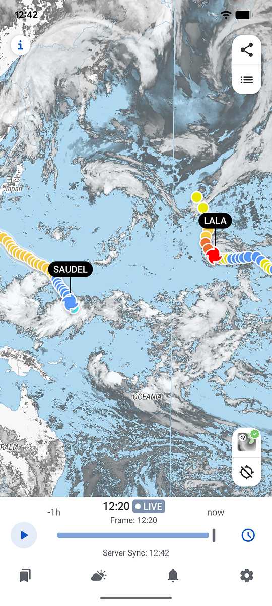 Tropical storm tracking on the world map in the RainViewer app, with named systems over the Pacific