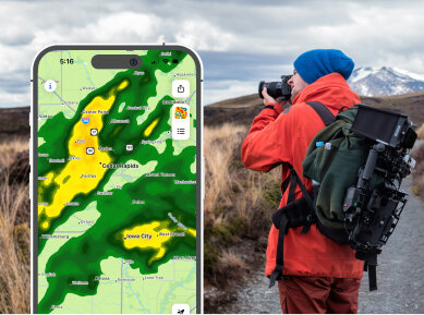 Picture of phone with Rain Viewer app open showing hourly weather forecast
